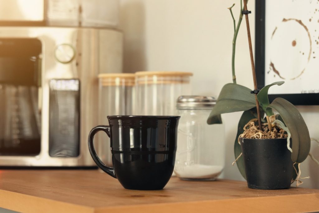 Coffee bar ideas featuring farmhouse cabinets, small coffee stations, hidden storage, luxury coffee bars and built-in home café setups