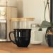 Coffee bar ideas featuring farmhouse cabinets, small coffee stations, hidden storage, luxury coffee bars and built-in home café setups